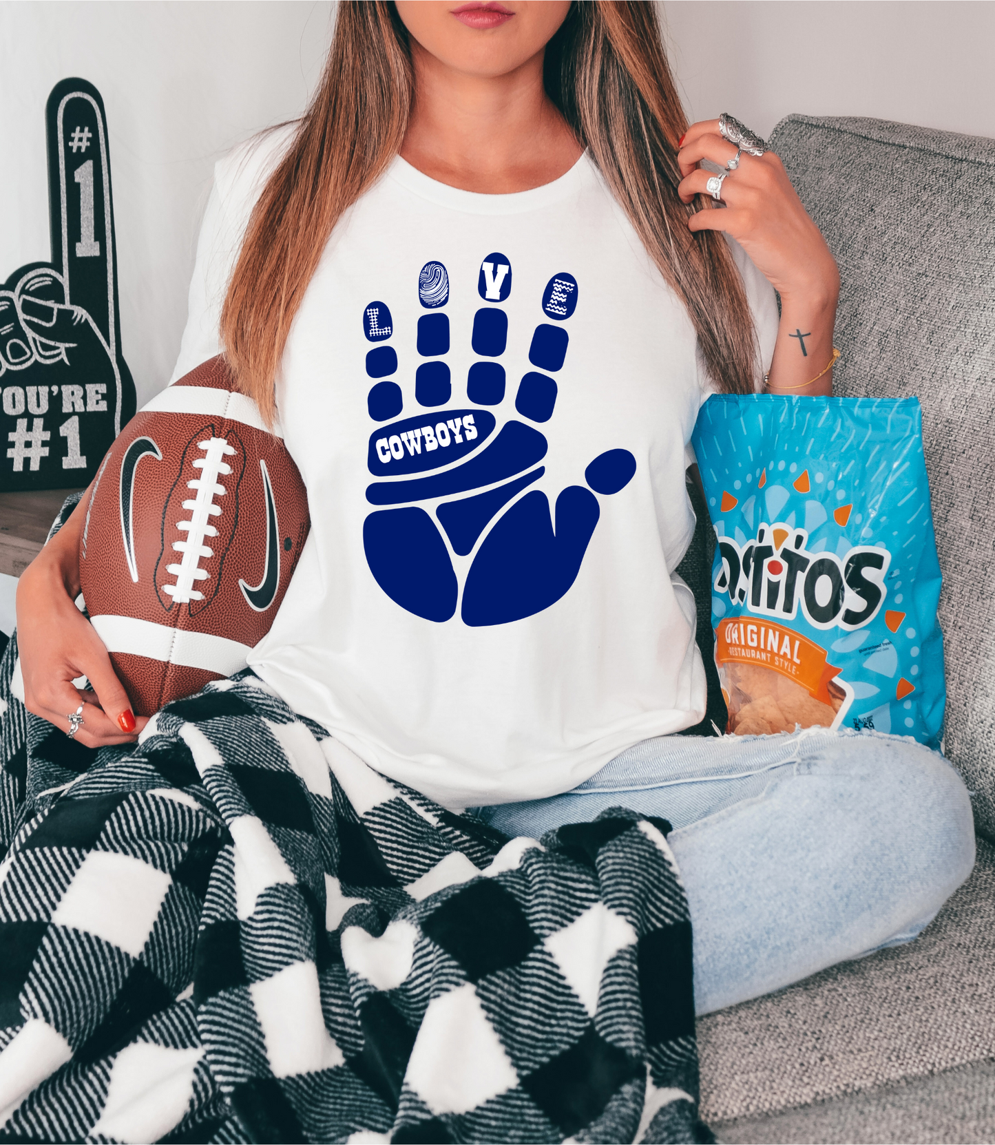 Cowboys on blue hand with love on fingertips