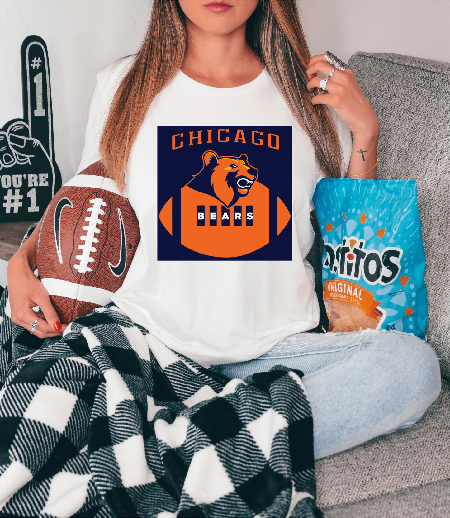 Chicago, bear head resting on football