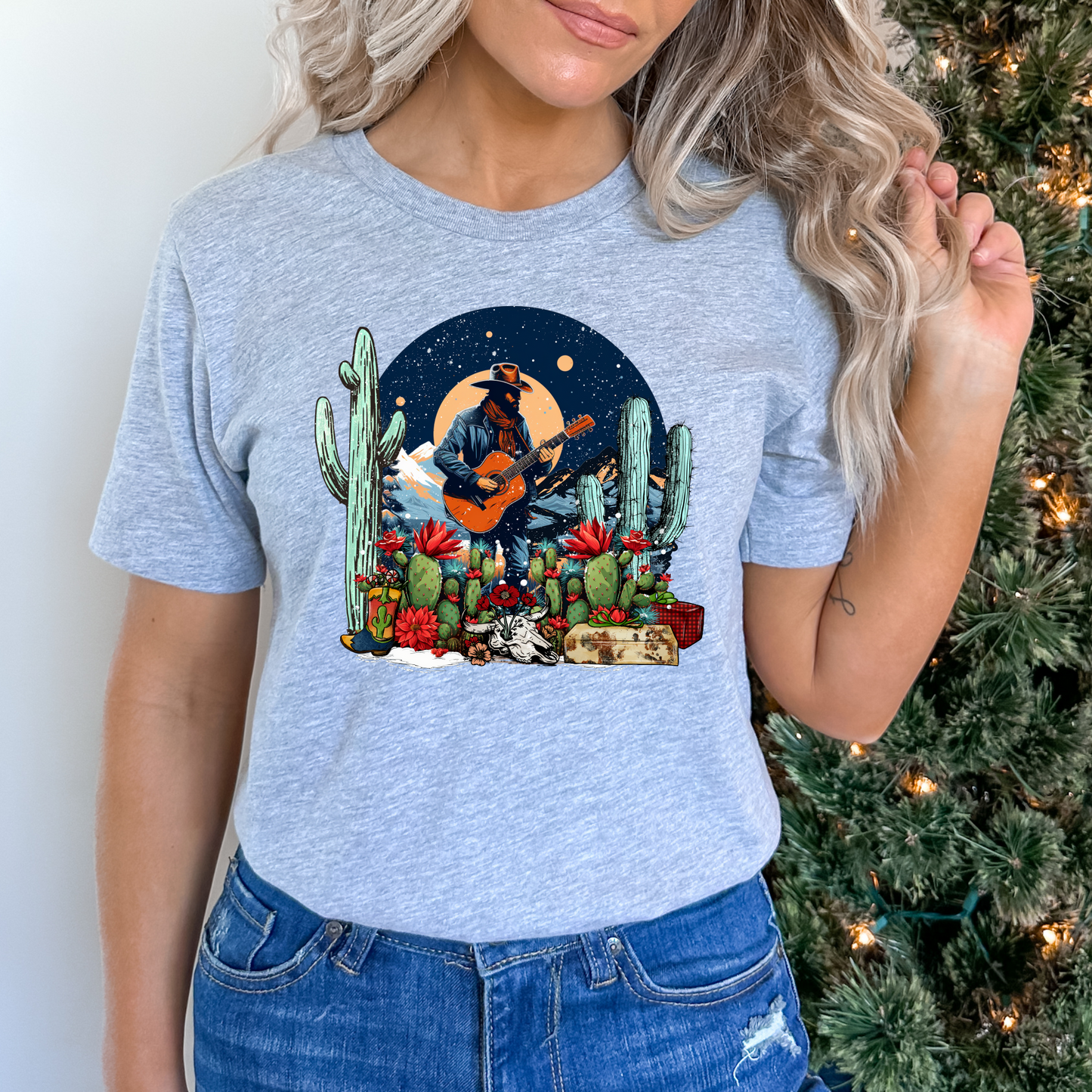 Cowboy playing guitar in cacti