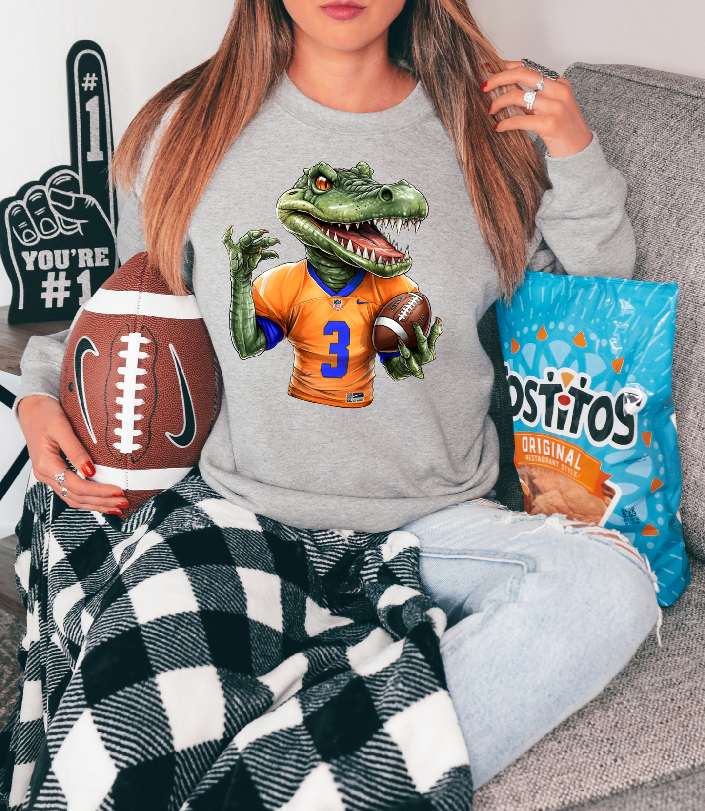 Gator holding football