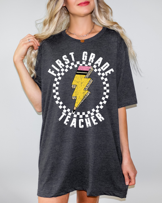 First Grade Teacher Pencil Lightning Bolt With Checkered Circle