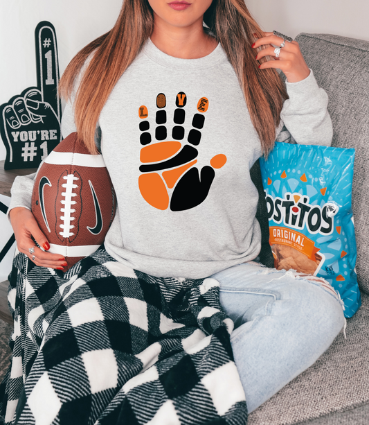 Orange/black hand with love on finger tips