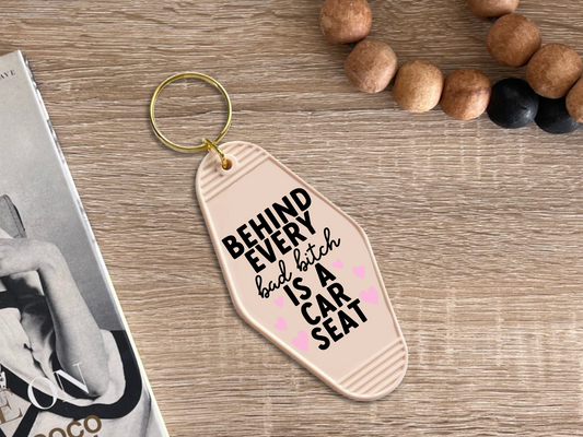 Behind Every Bad bitch is a car seat - Motel keychain